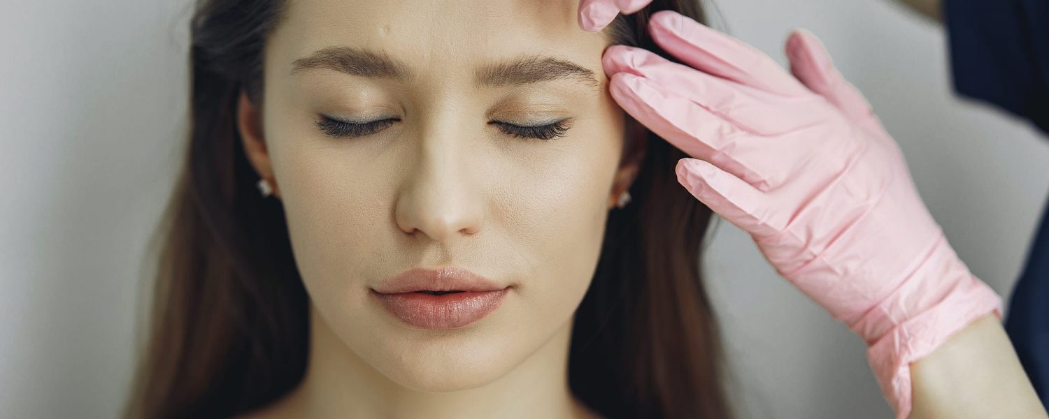 Woman with a doctor in cosmetology studio